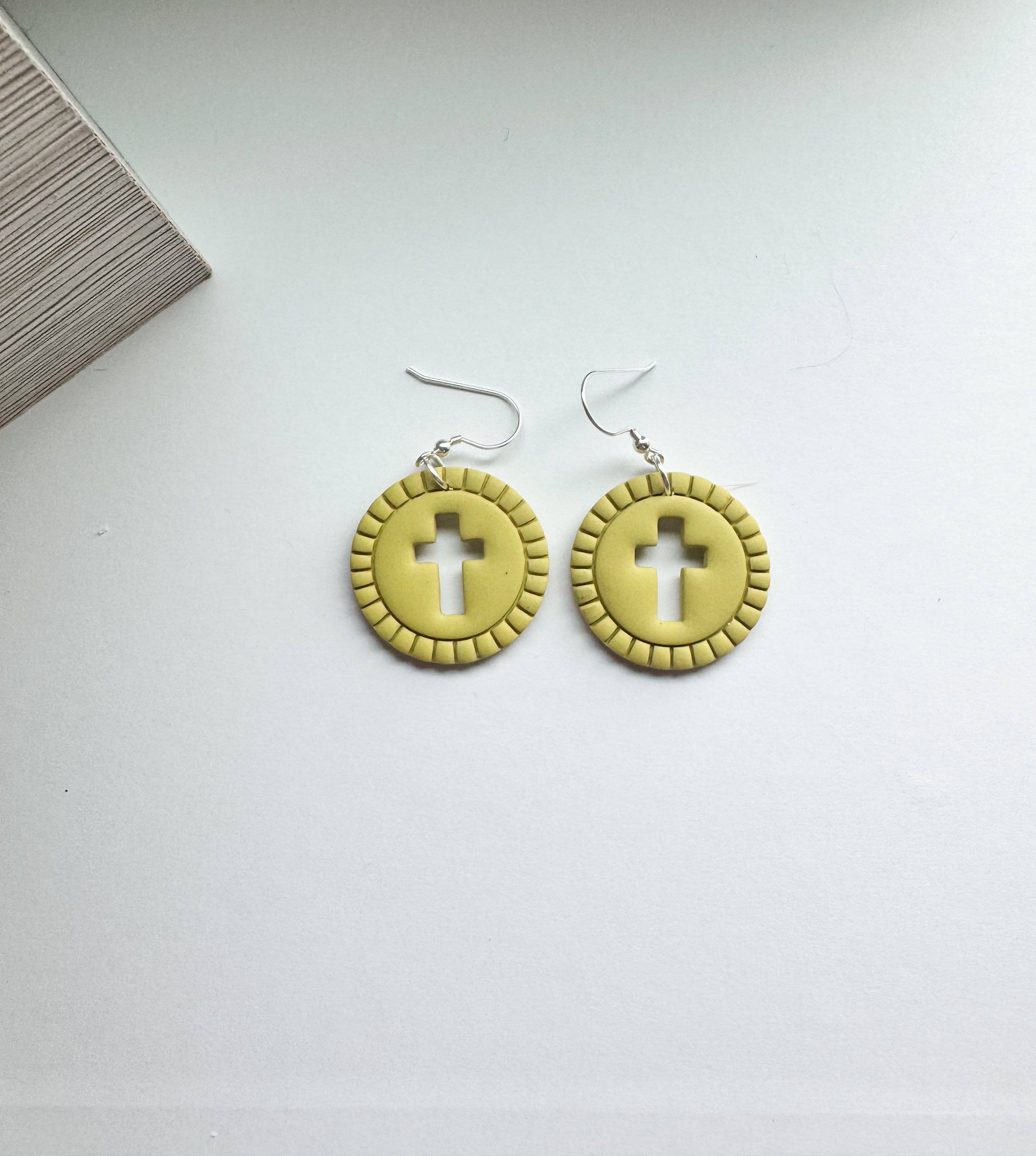 Grace Glow: cross cut out round dangles