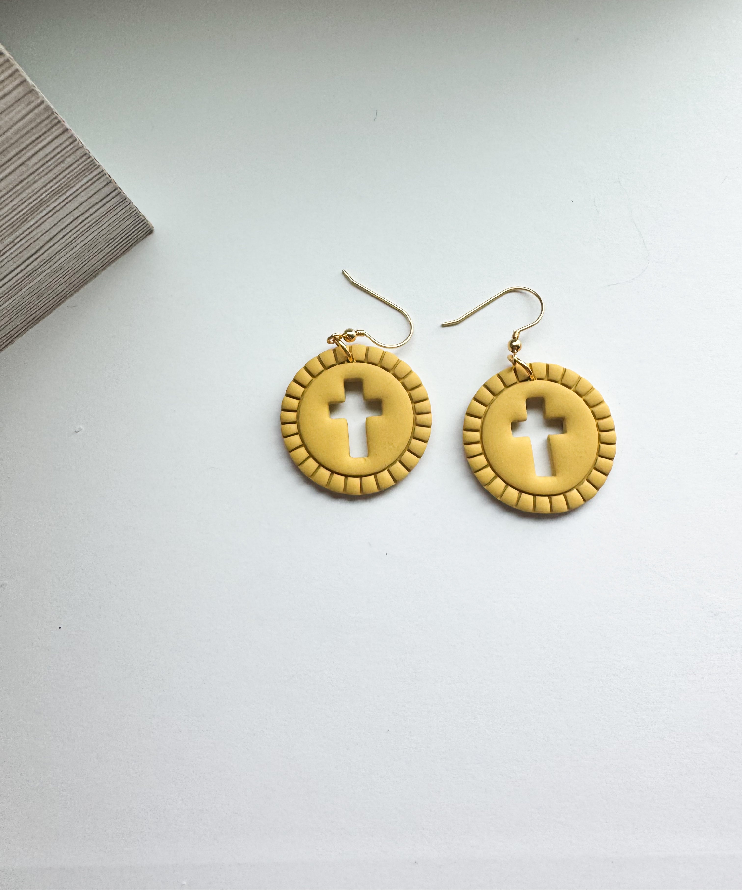 Grace Glow: cross cut out round dangles