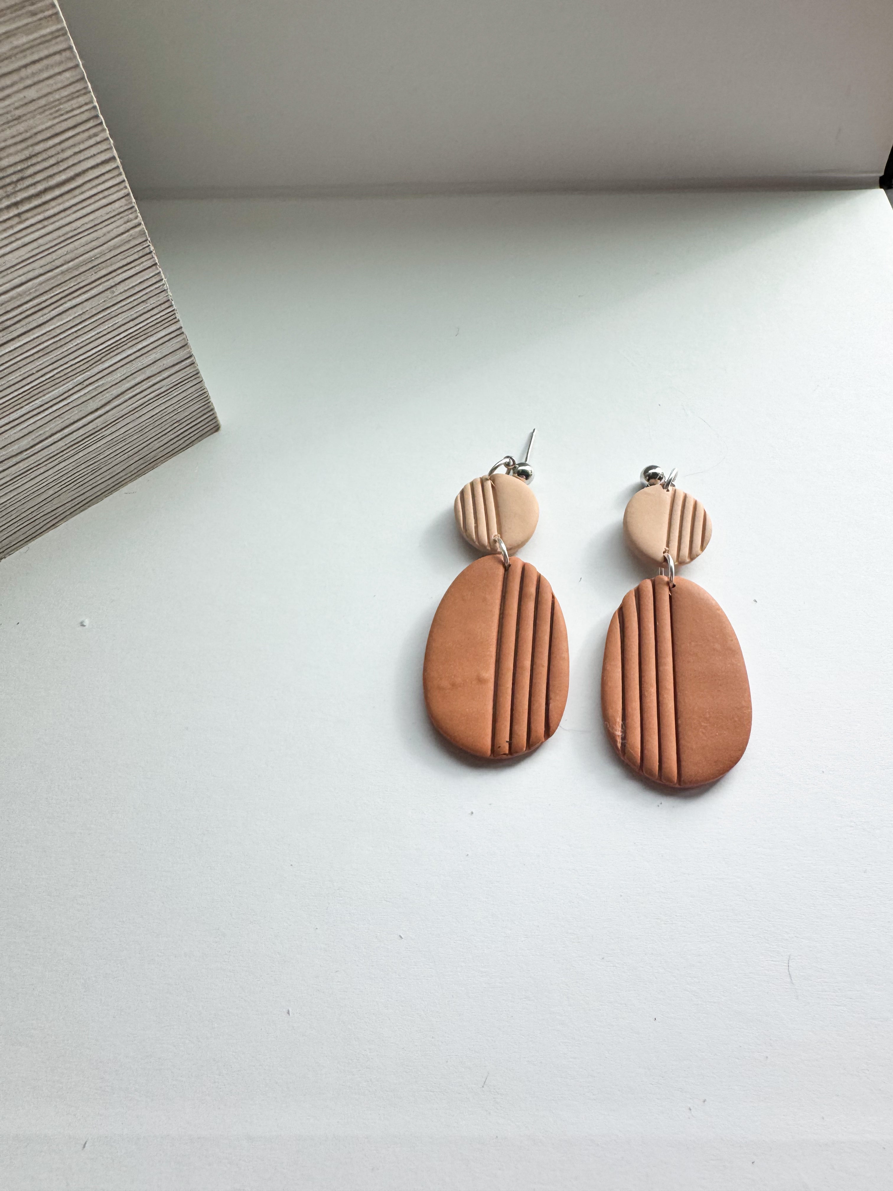 Blush Drift: muted tone oval dangles with strips