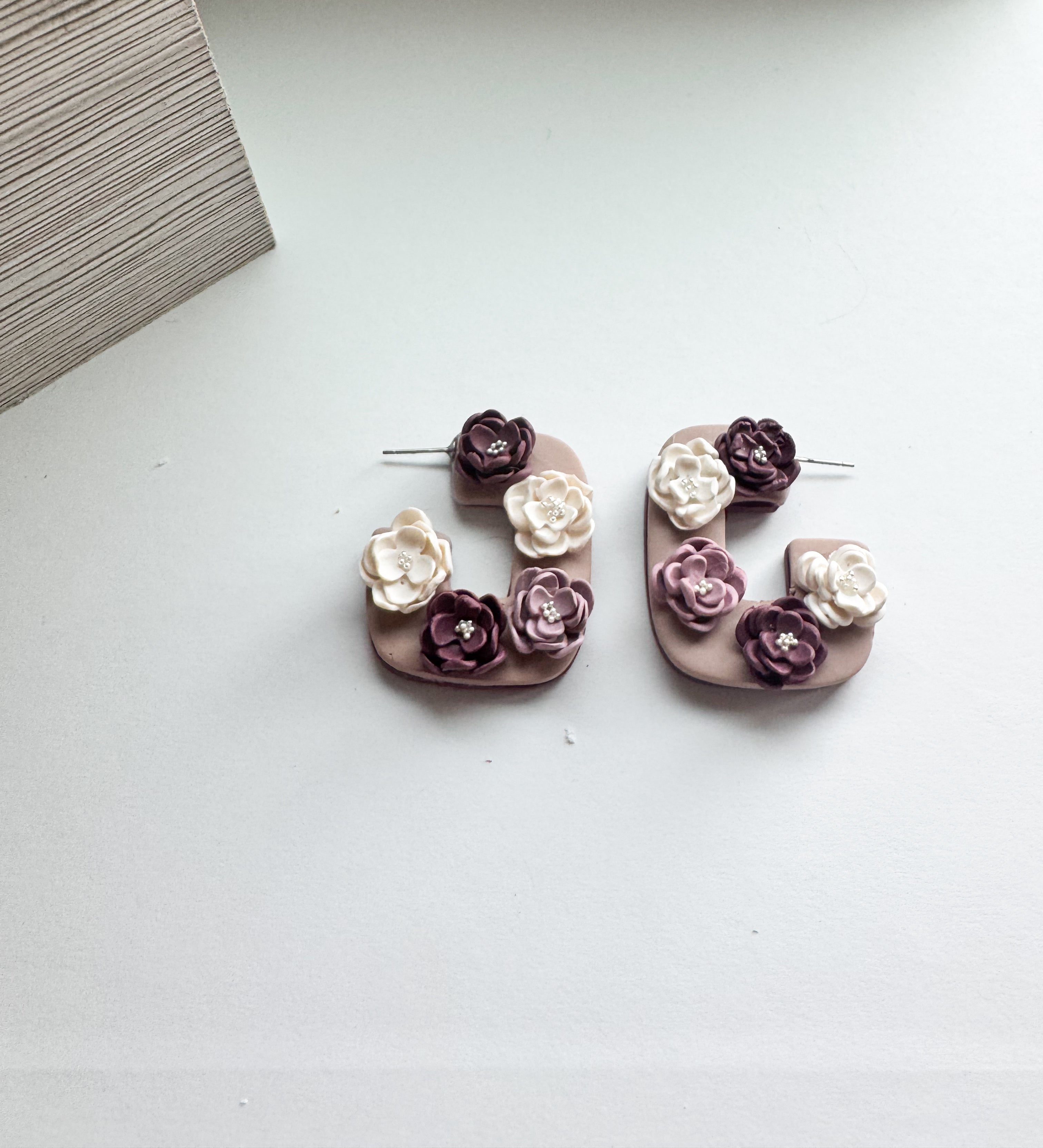 Dusky Garden: Floral Cluster hoops in ivory, plum, and mauve.