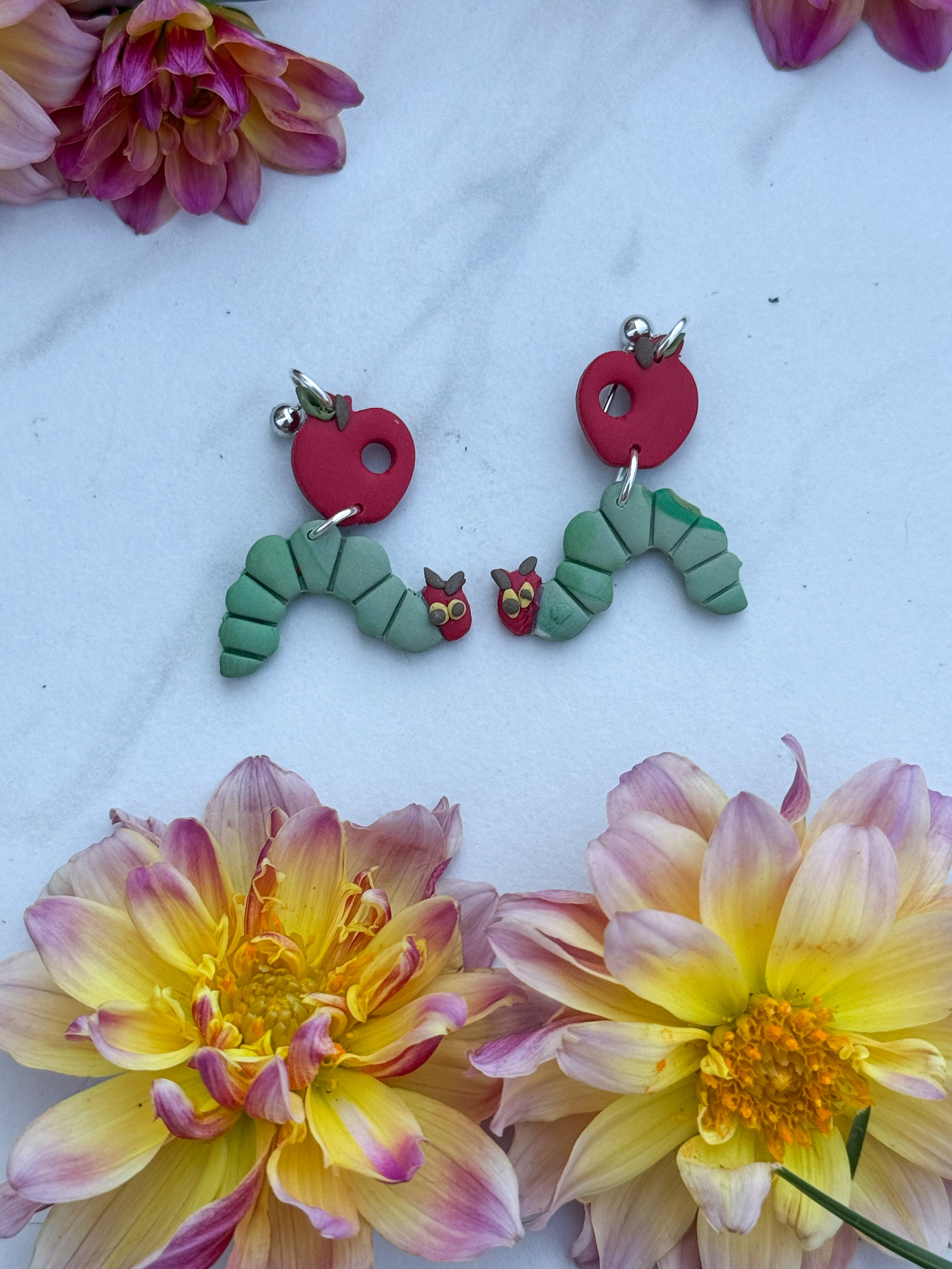 A  hungry caterpillar clay earrings